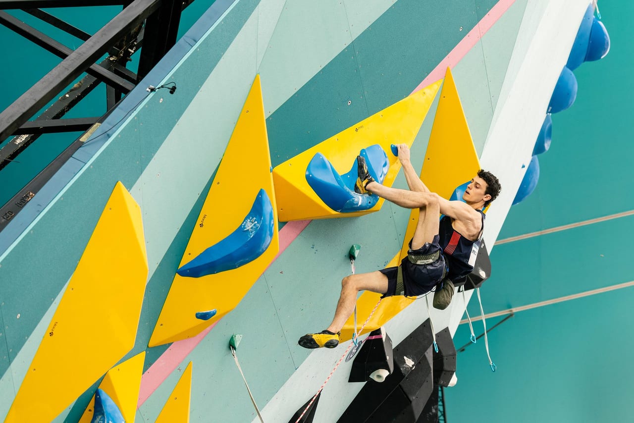 Hamish McArthur competing on the international bouldering circuit