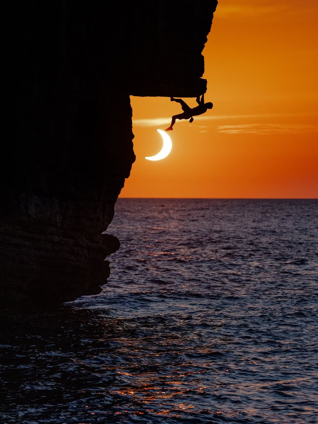 Chris Sharma climbs alongside a solar eclipse in Mallorca with a dream team