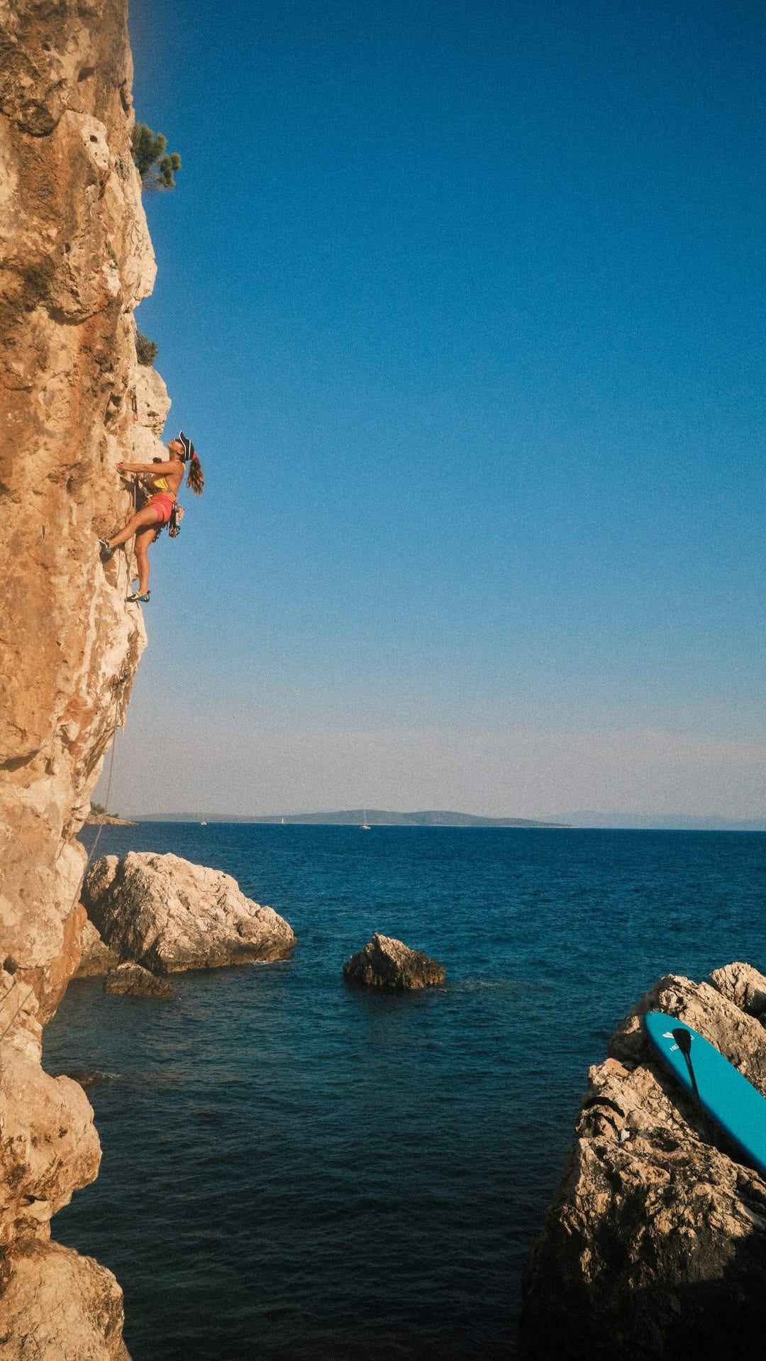 Sasha DiGiulian climbing a seaside route on Hvar, Croatia