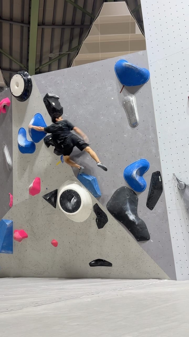 Tomoa Narasaki bouldering during a training camp in Japan