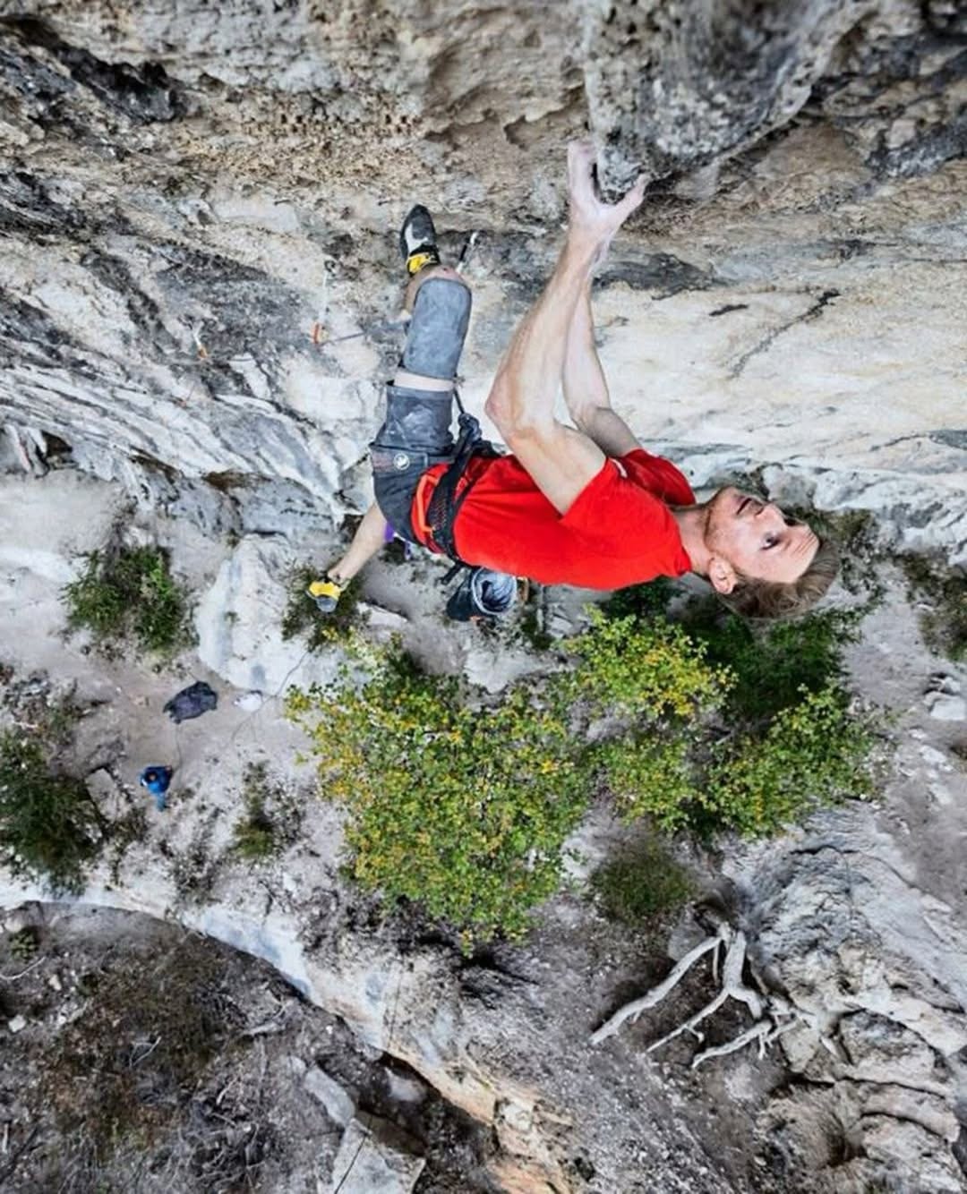 Jakob Schubert lead climbing on steep limestone