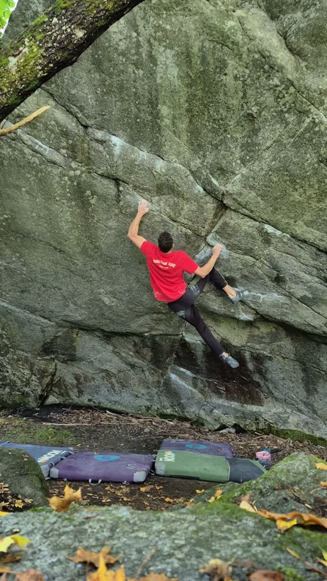 Climber drying the holds on the Castle Low Low boulder