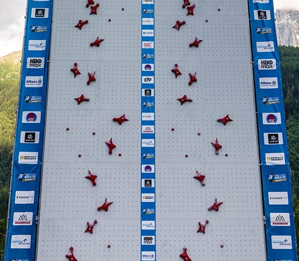 An empty competition speed wall with red holds