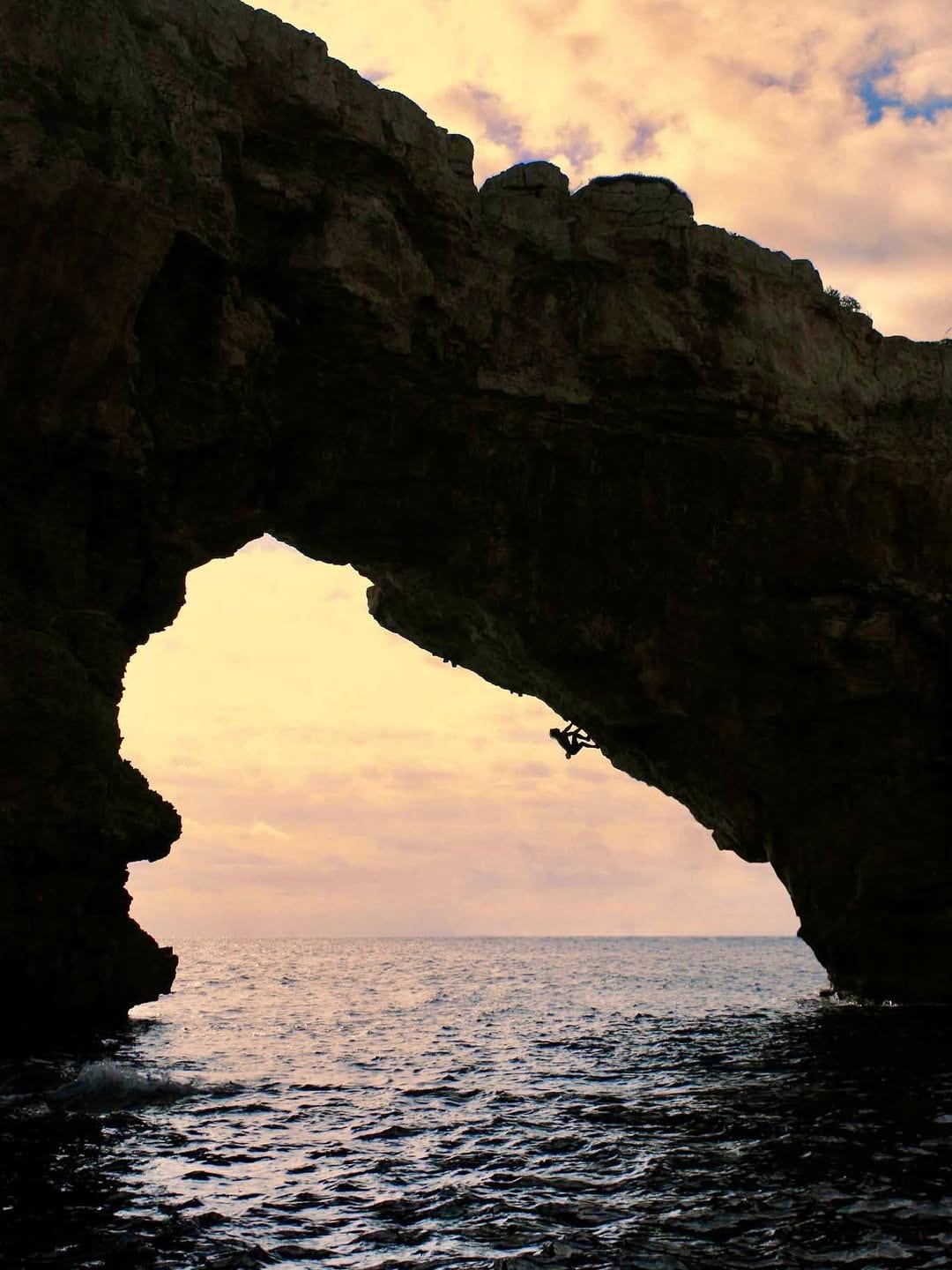 The Es Pontas sea arch rising out of the sea off Mallorca