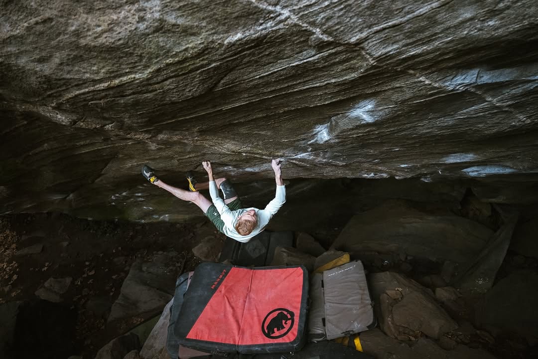 Jakob Schubert on the steep face of the Mount Doom boulder