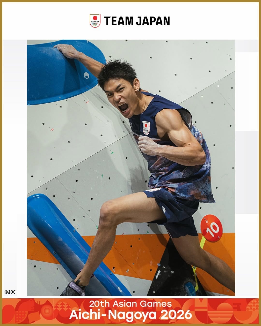 Tomoa Narasaki in a Team Japan vest making a powerful move on a competition wall