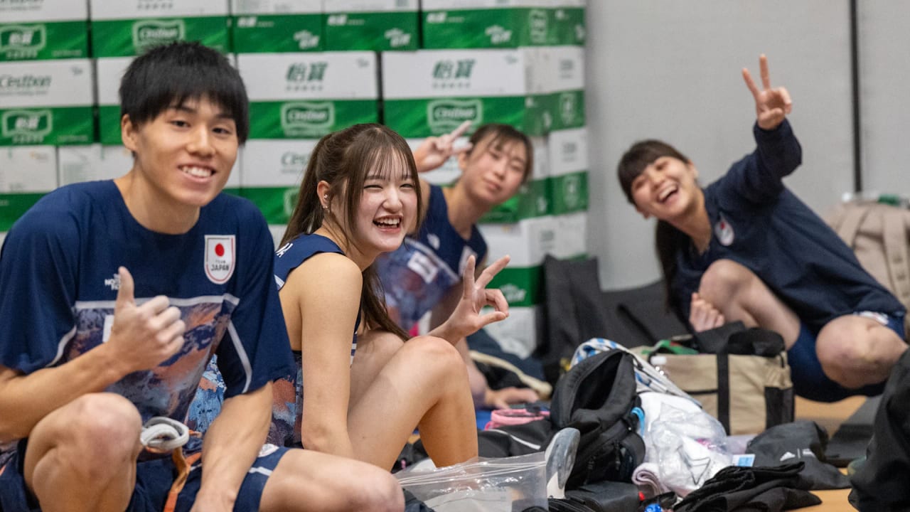 Smiling members of the Japanese team in the athlete area in Wujiang
