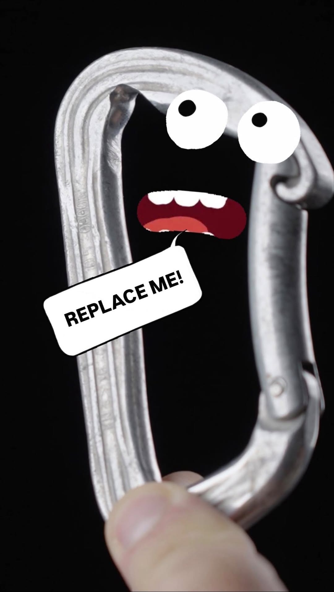 A worn carabiner with cartoon eyes and a speech bubble saying Replace me
