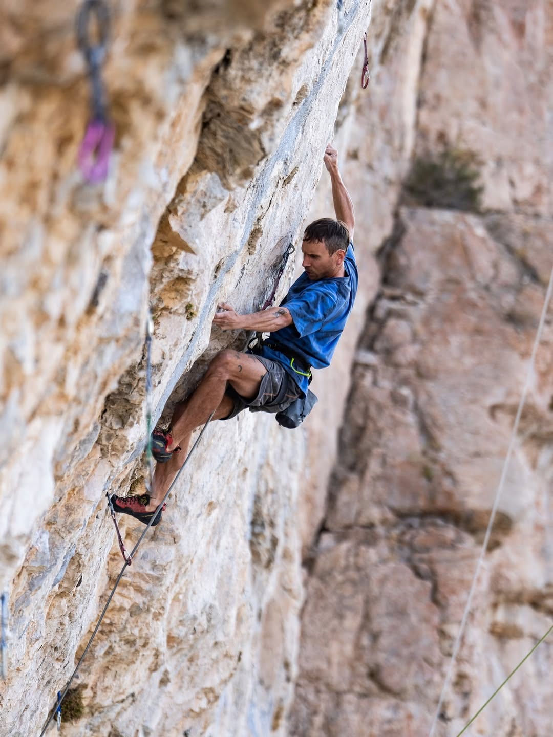 Jonathan Siegrist climbing an overhanging limestone wall