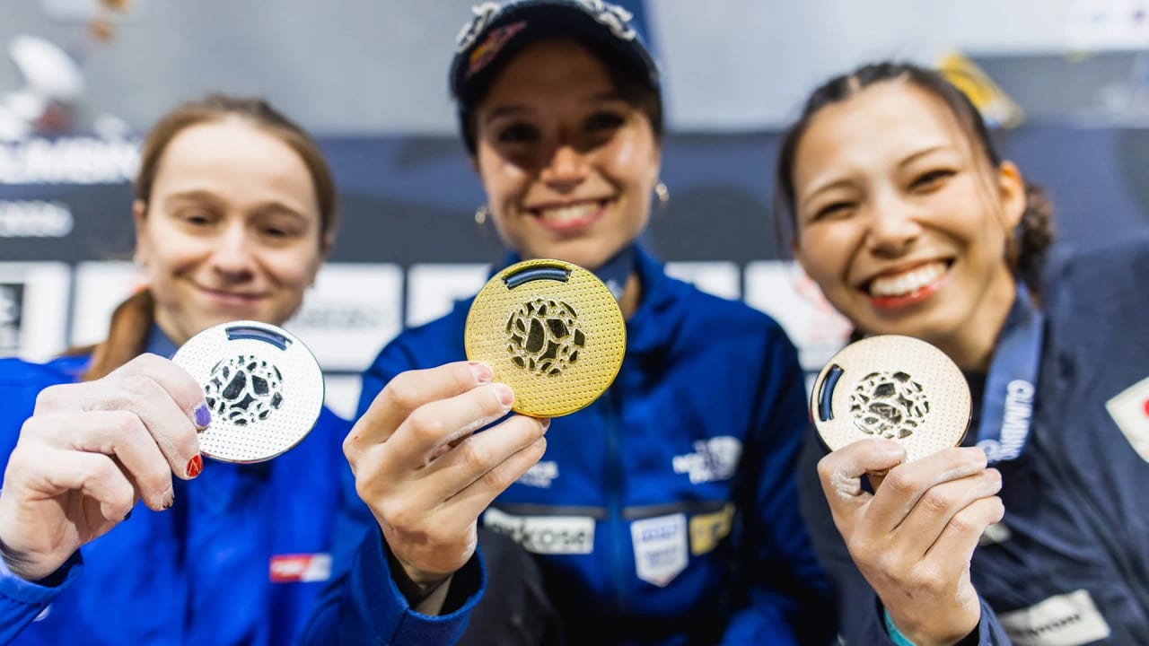 Erin McNeice, Oriane Bertone and Mao Nakamura holding up their silver, gold and bronze medals