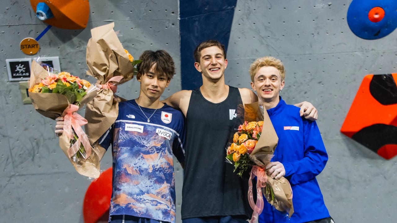 Rei Kawamata, Yonatan Katz and Max Milne holding flowers on the podium in Salt Lake City