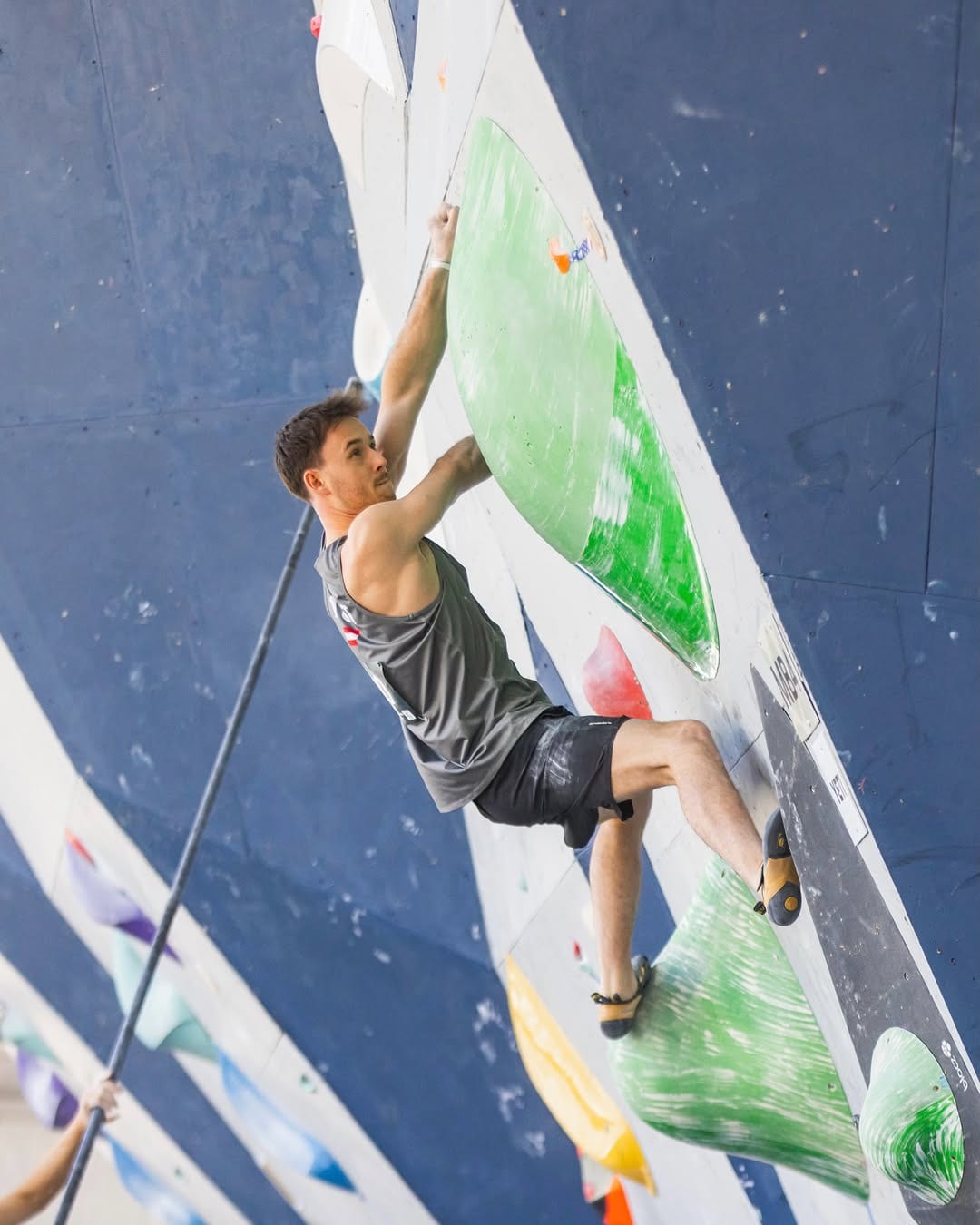 Nicolai Uznik on a competition boulder in Salt Lake City